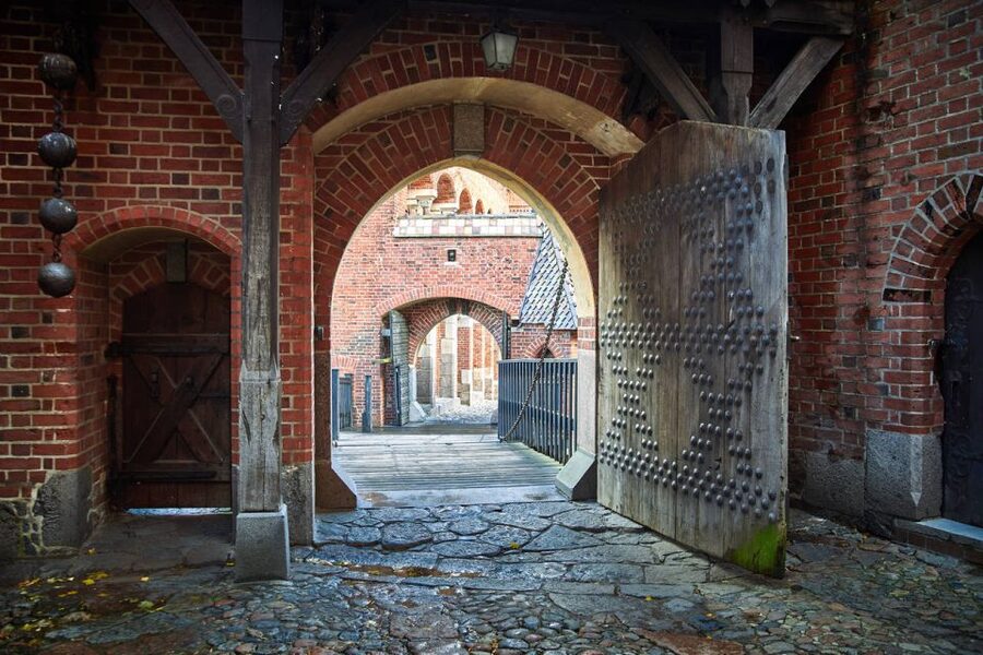 From Gdansk: Half-Day Malbork Castle Tour with Audioguide - Entering the 13th-century fortress