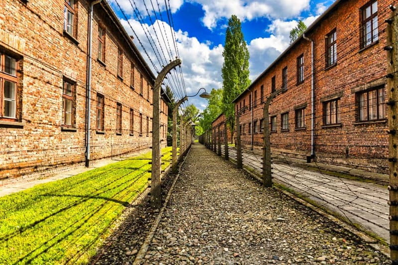 From Krakow: Auschwitz-Birkenau Guided Tour with Transport - Auschwitz I and the Arbeit Macht Frei gate