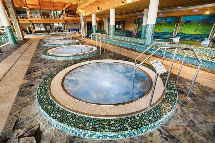 From Krakow: Chochołowskie Thermal Baths Ticket and Transfer - Family attractions and adult relaxation