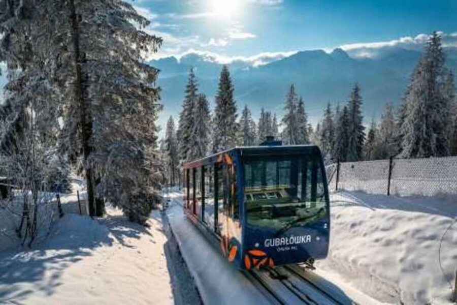 From Krakow: Zakopane Tour with Hotel Pickup & Thermal Baths - Krupowki Street, food, and shopping
