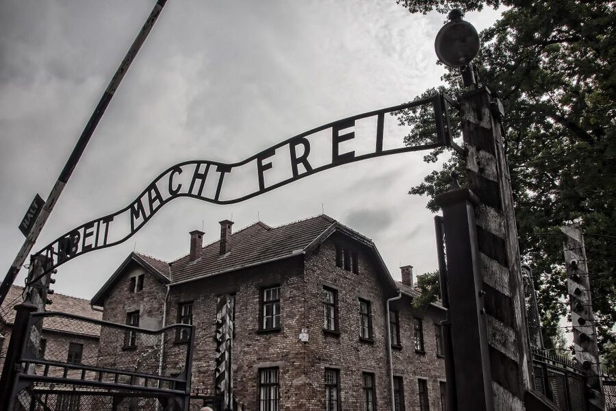 From Warsaw: Auschwitz-Birkenau Guided Tour with Fast Train - Entering Auschwitz I
