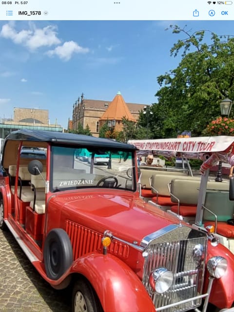 Gdańsk: City Tour by Electric Golf Cart - Highland Gate, Prison Tower, and the city’s harsher past