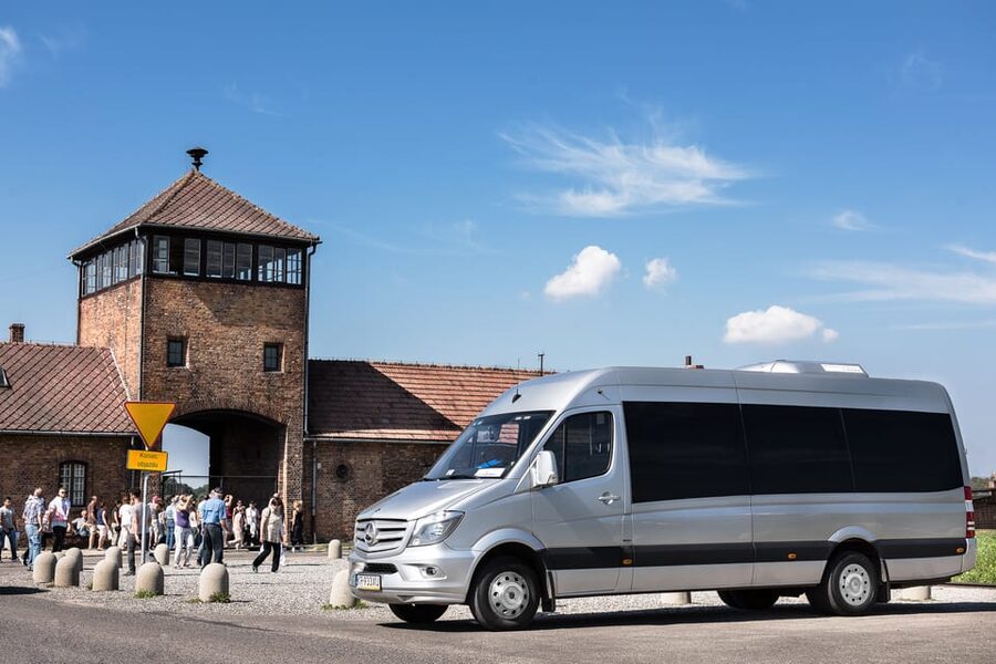 Krakow: Auschwitz-Birkenau & Wieliczka Salt Mine Day Tour - Entering Auschwitz I with the museum guide