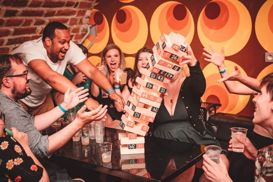 Krakow: Pub Crawl with 1 Hour of Unlimited Alcoholic Drinks - The first stop: one hour of unlimited drinks and games