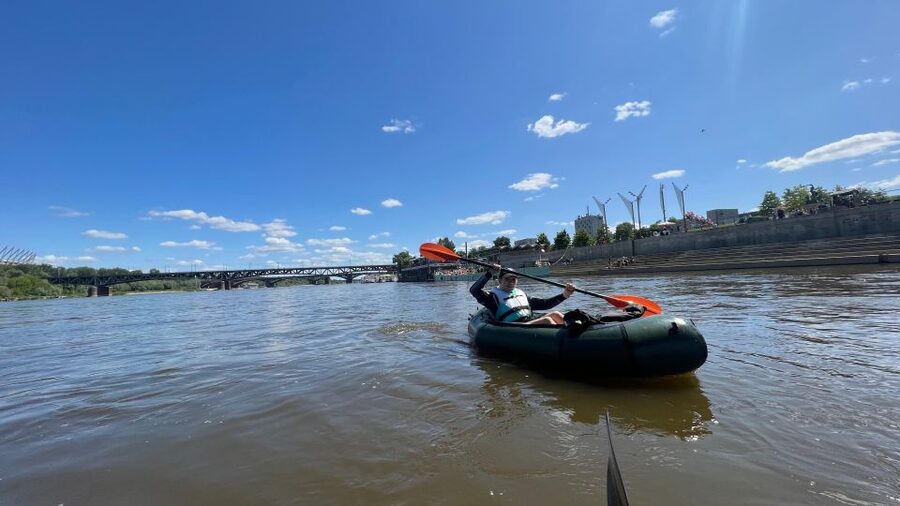 Packrafting kayaking guided tour Vistula river Warsaw Poland - Sunset over the Old Town