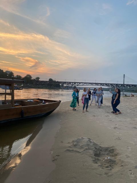 Warsaw: Vistula River Sunset Cruise with Welcome Drink - A wooden boat with room for changing weather